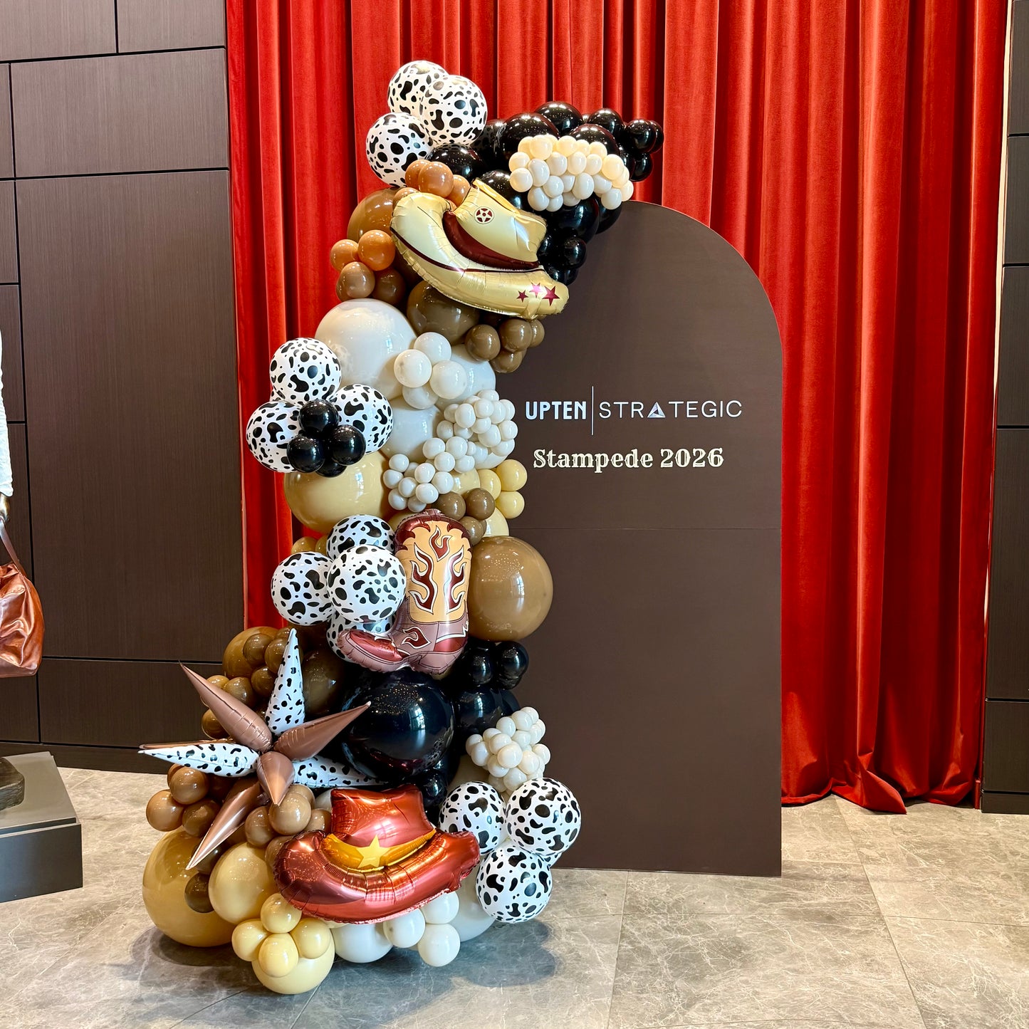Custom Painted Wooden Arch & Western Balloon Garland | Calgary Stampede Corporate Decor