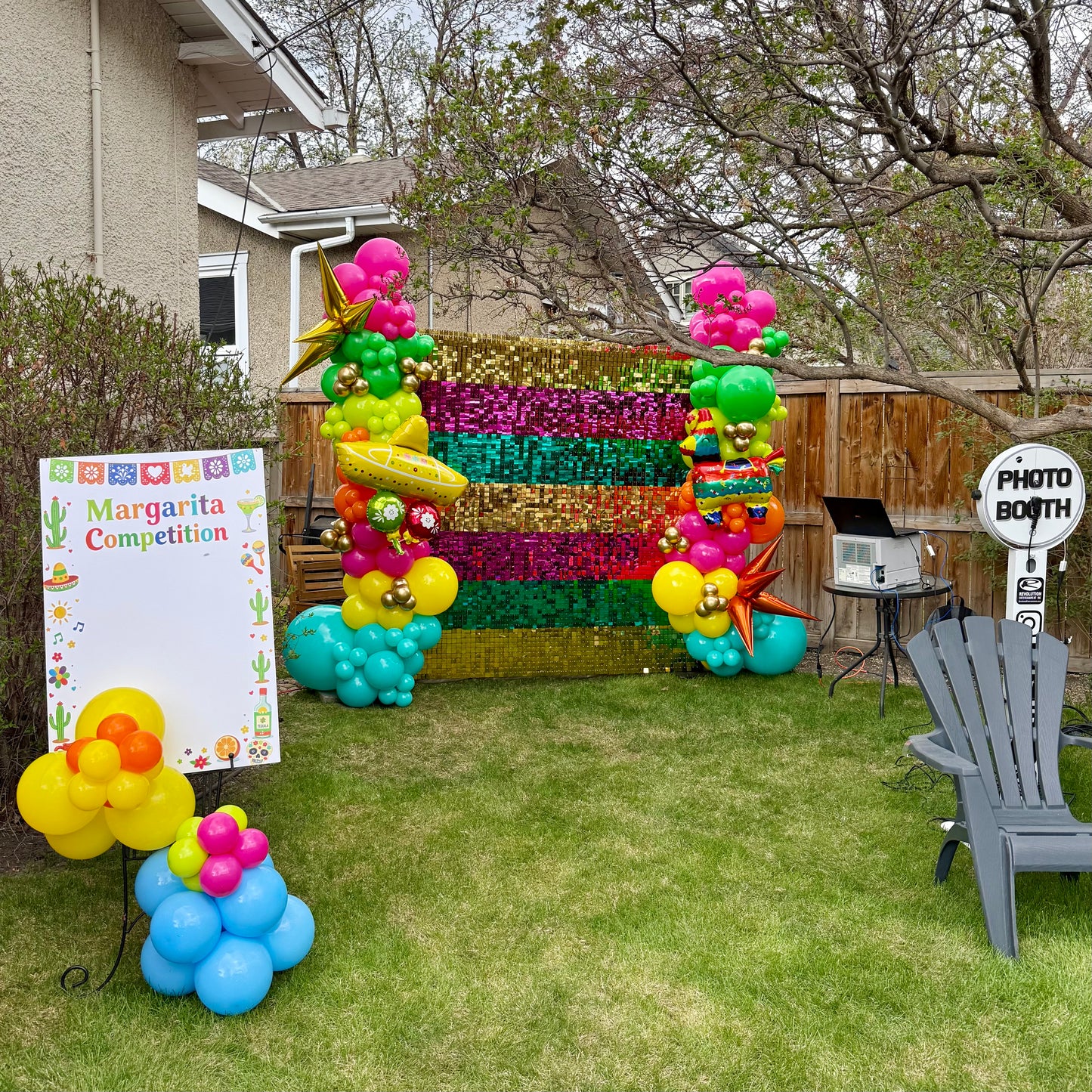 Vibrant Fiesta Shimmer Wall Photo Zone & Custom Balloon Arch