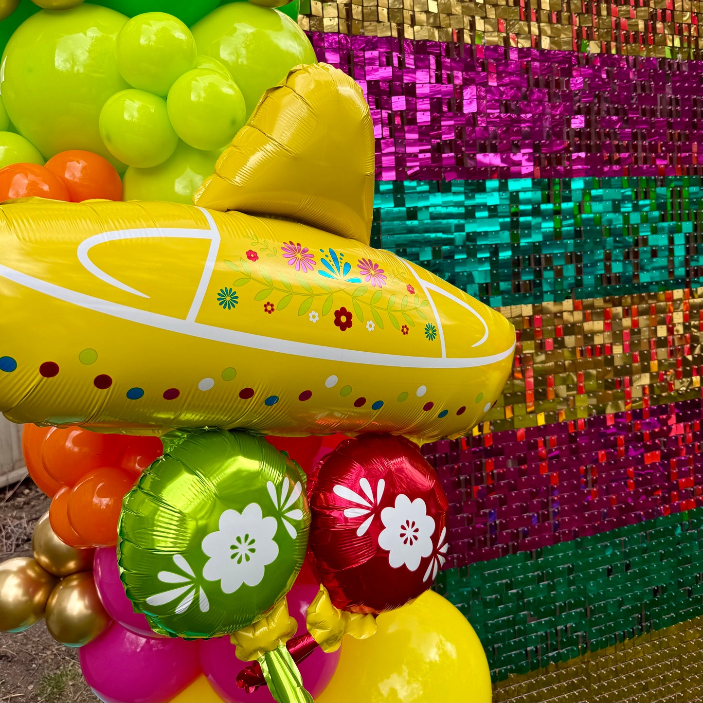 Vibrant Fiesta Shimmer Wall Photo Zone & Custom Balloon Arch