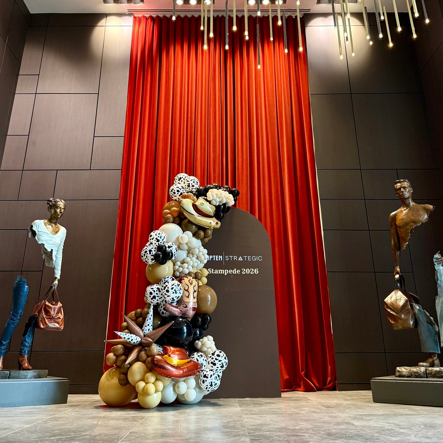 Custom Painted Wooden Arch & Western Balloon Garland | Calgary Stampede Corporate Decor