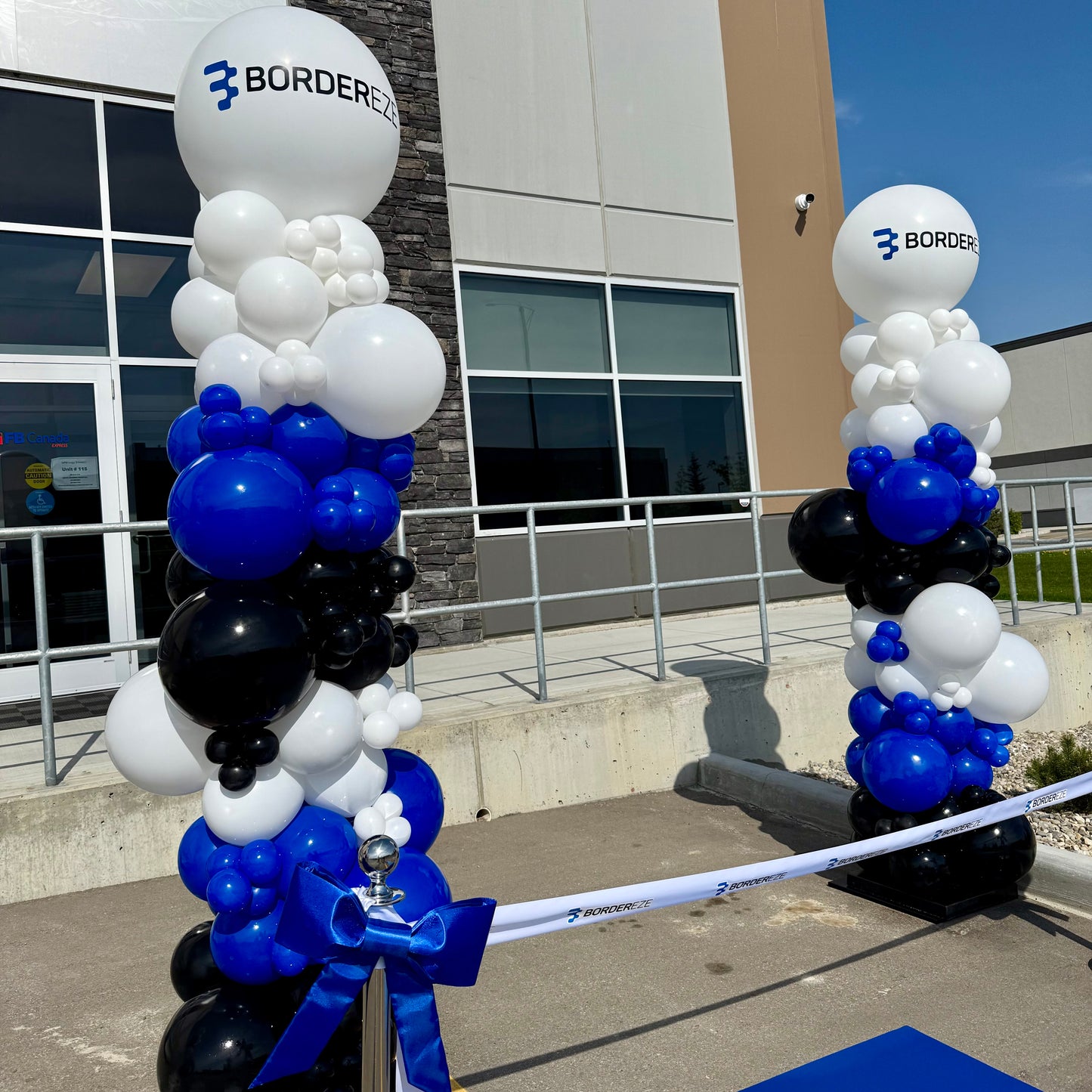 Oversized Organic Balloon Pillar with Custom Logo | Calgary Corporate Event Decor
