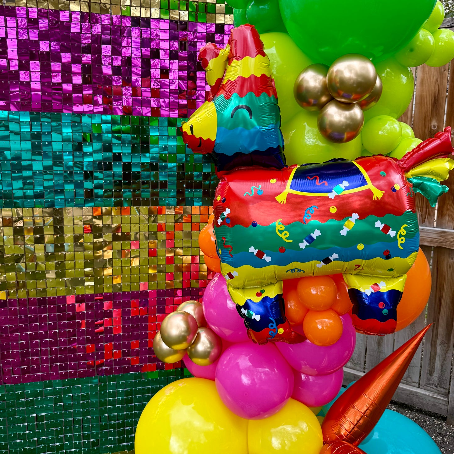 Vibrant Fiesta Shimmer Wall Photo Zone & Custom Balloon Arch
