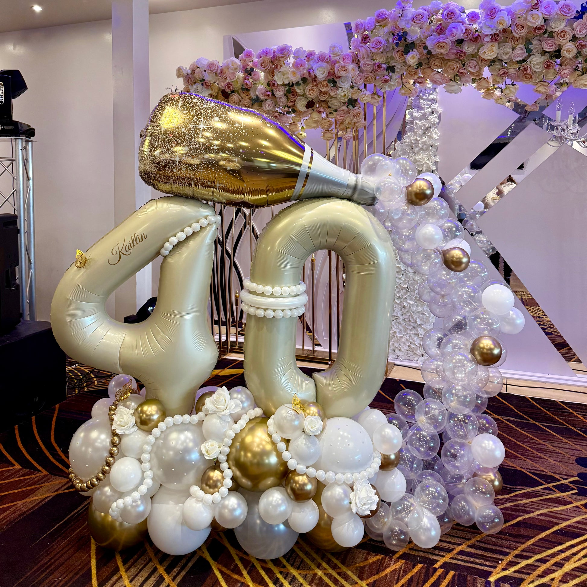 40th birthday champagne bottle balloon marquee with flowing clear balloon bubbles Calgary event decor