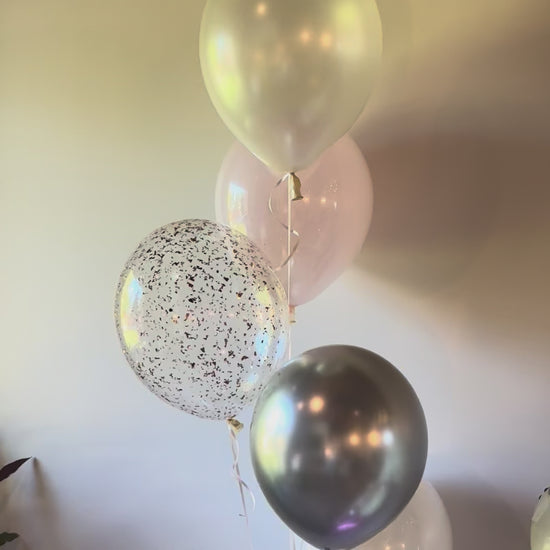 360 video view of elegant pastel pink and silver milestone balloon centerpiece Calgary