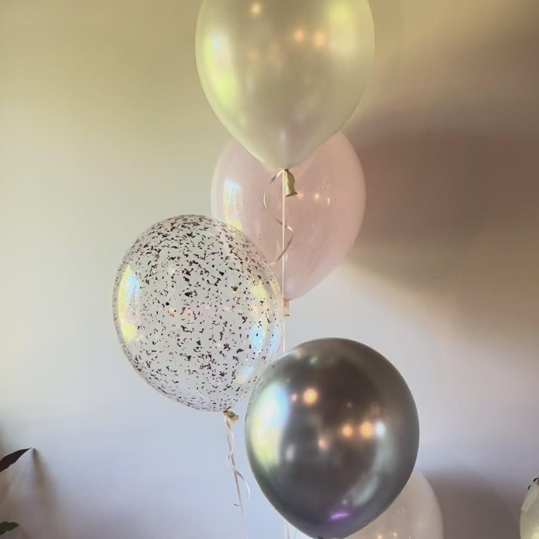 360 video view of elegant pastel pink and silver milestone balloon centerpiece Calgary