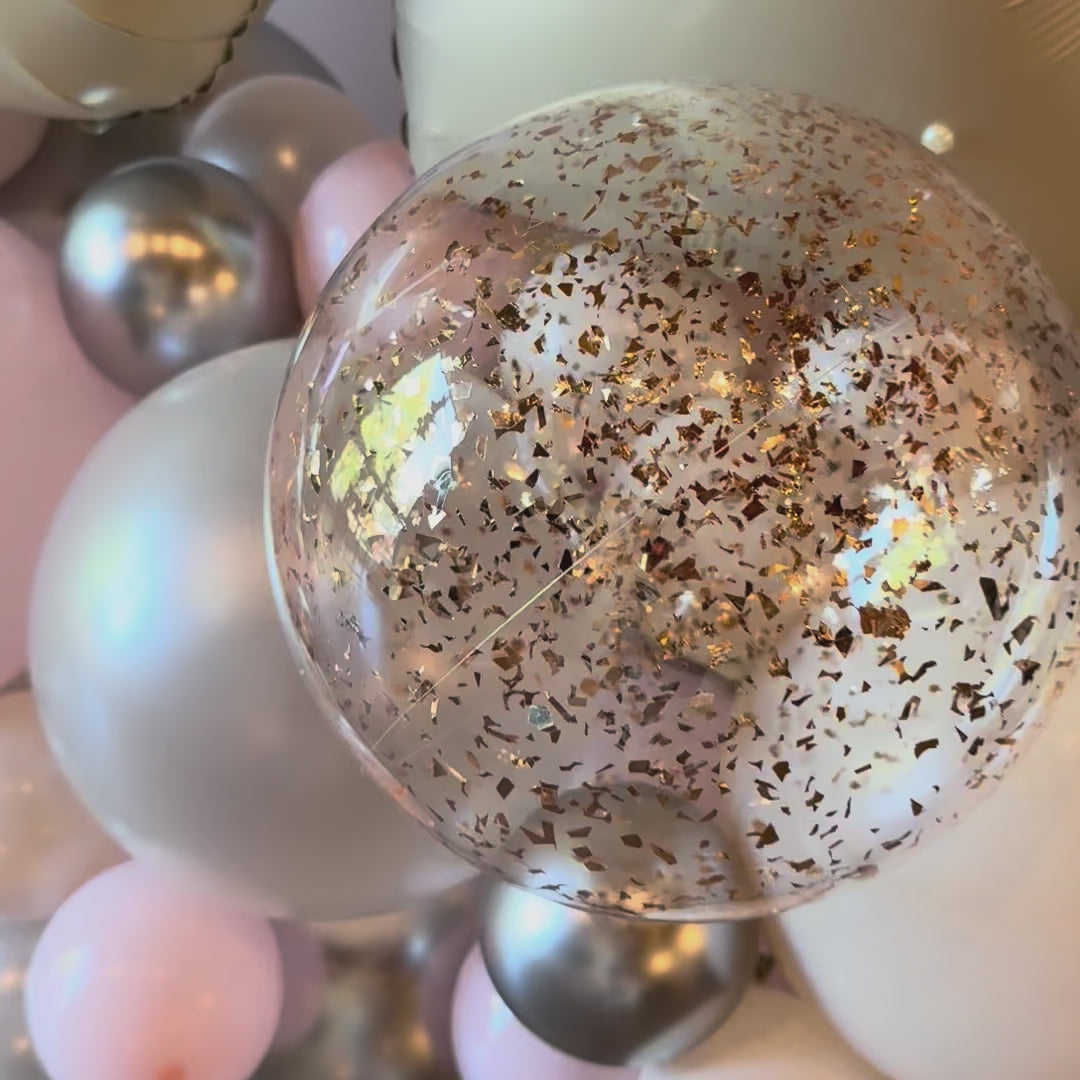 Silver confetti and blush pink organic balloon stack base for 21st birthday photo zone Calgary